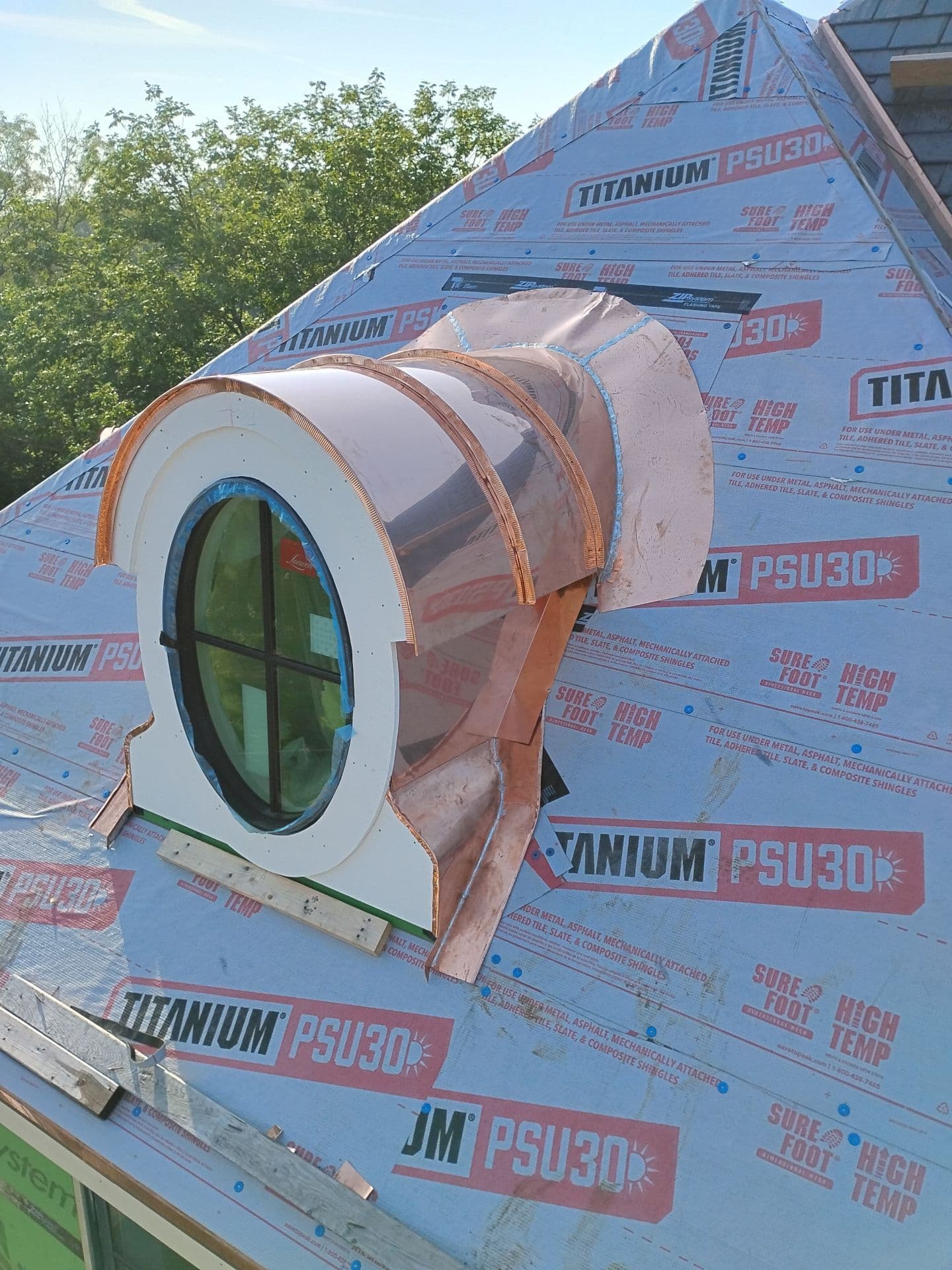 Custom copper radius fabrication around an architectural roof opening